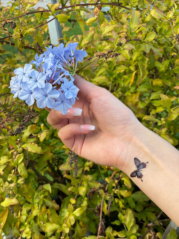 Blue flying Butterflies Tattoo